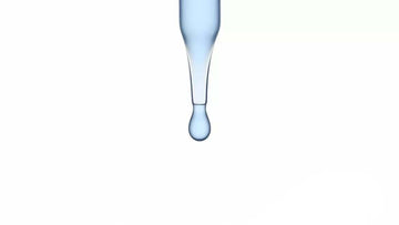 stock image of a cosmetic dropper with light blue liquid