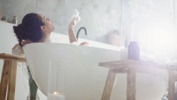 photo of woman in bathtub relaxing