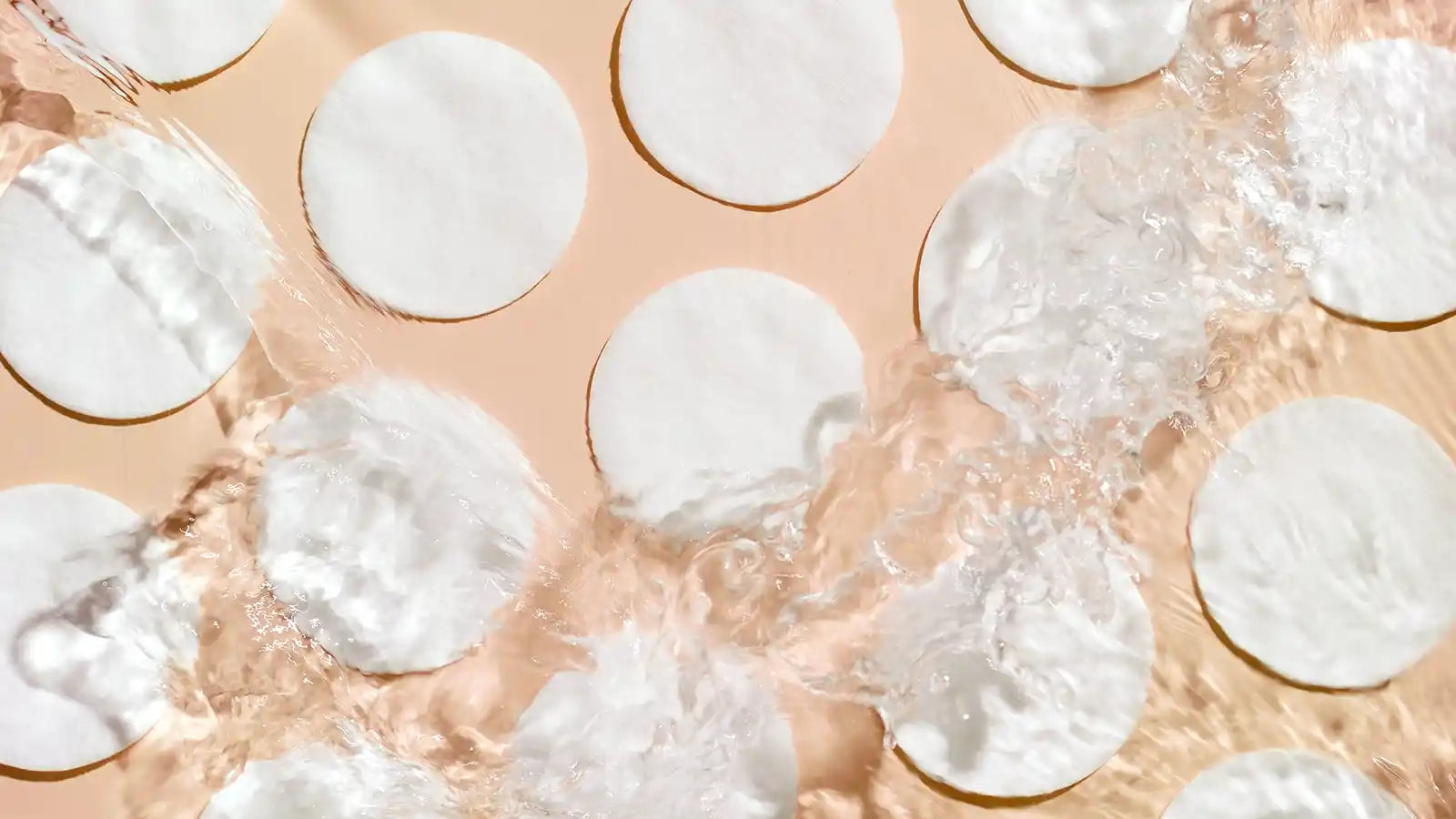 stock photo of cotton rounds having liquid splashed on them