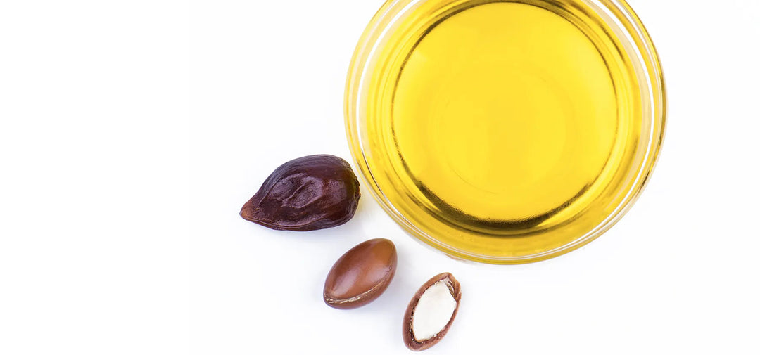 stock image of argan nuts and argan oil